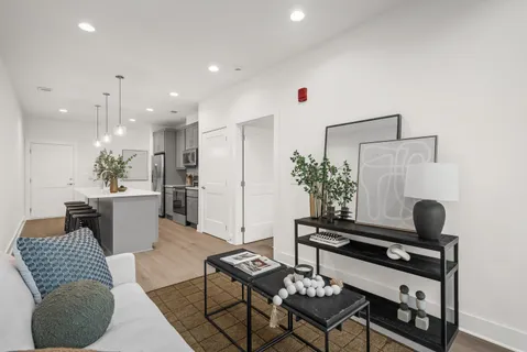 a kitchen with a refrigerator and a sink