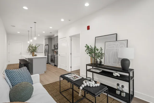 a kitchen with a refrigerator and a sink