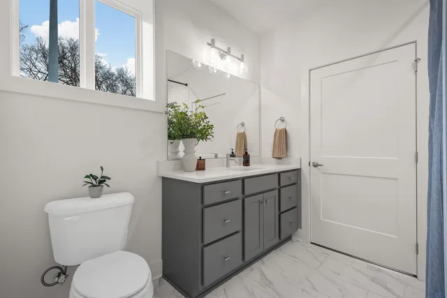 a bathroom with a bathtub and shower