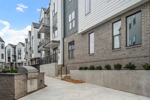 a view of a street with sitting on deck