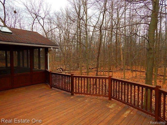 2263 North Fairview Lane Rochester, MI 48306 - Photo 19 of 21 sunroom.deck.woods.jpg