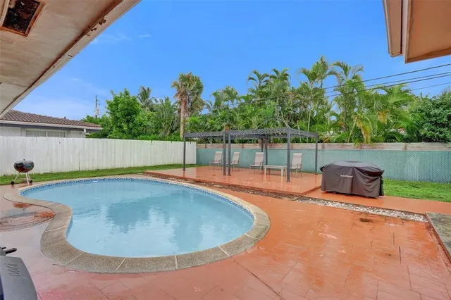 a view of outdoor space and swimming pool