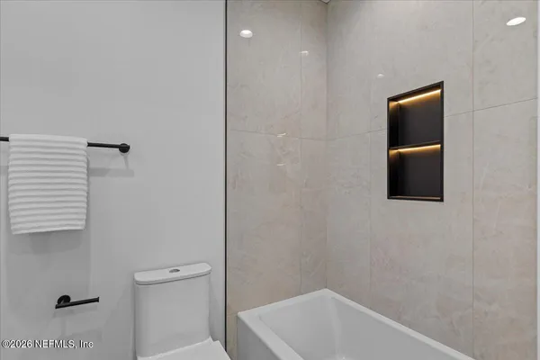 a front view of a building with a street