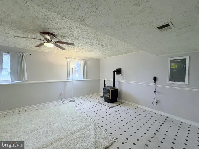 a very nice looking room with a ceiling fan