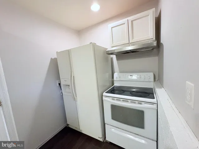 a kitchen with a stove and a microwave