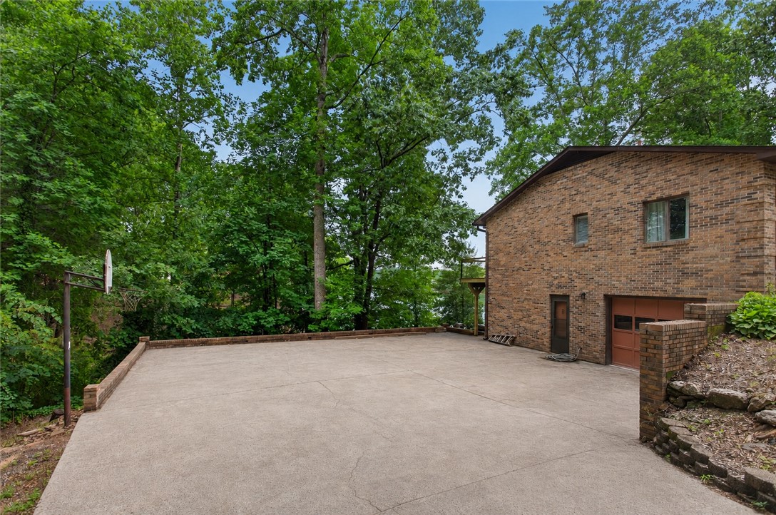 304 Lakeside Drive Seneca, SC 29672 - Photo 41 of 50 A spacious concrete driveway offers ample parking for many guests.