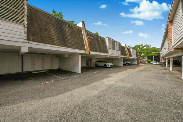 a view of a car park in front of a building