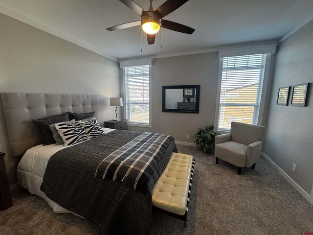 a bedroom with a bed and a couch