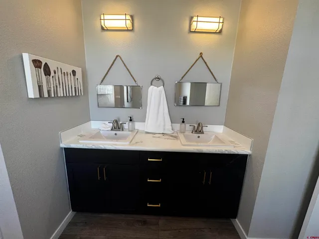 a bathroom with a glass shower door