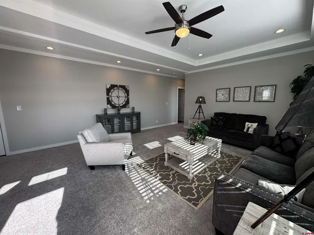 a kitchen with stainless steel appliances kitchen island granite countertop a sink a stove and a wooden floors