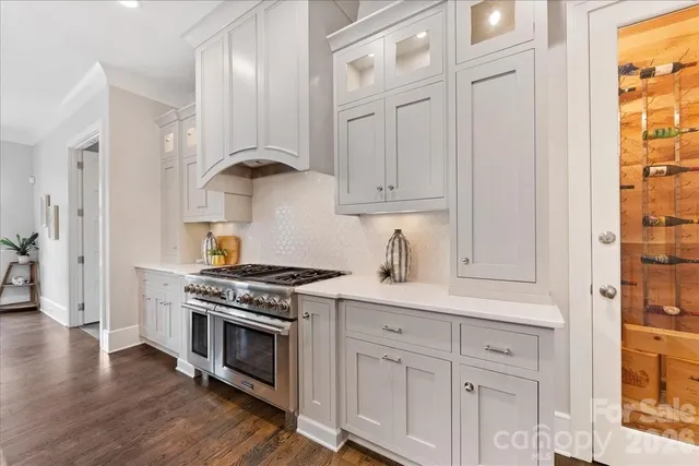 a kitchen with stainless steel appliances granite countertop a stove and a refrigerator