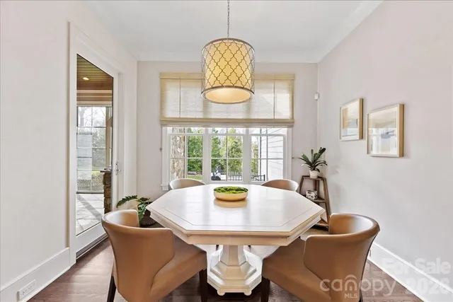 a kitchen with granite countertop a sink stove and cabinets
