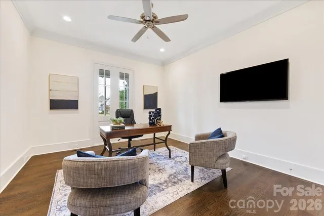 a bedroom with a bed a table and chair