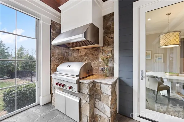 a outdoor dining space with furniture and outdoor view