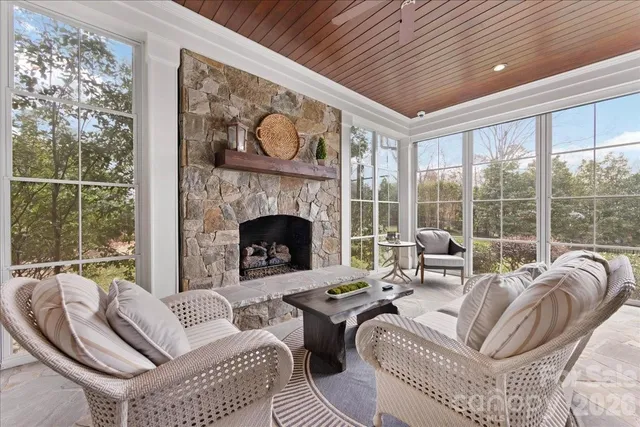 a spacious bathroom with a granite countertop sink and a mirror