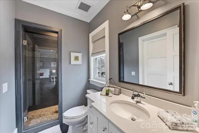 a view of a workspace with furniture and wooden floor