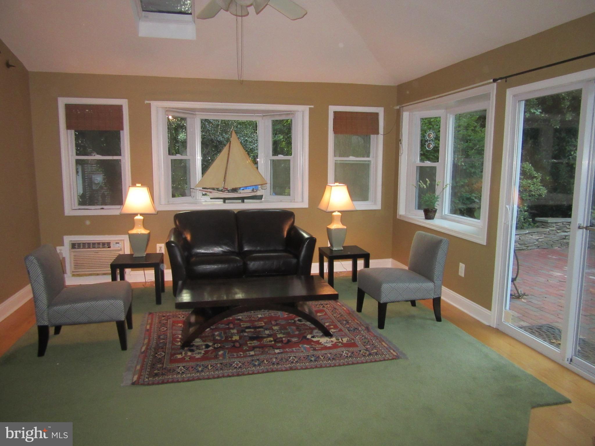 720 Murdock Road Baltimore, MD 21212 - Photo 8 of 27 a living room with furniture a window and a table