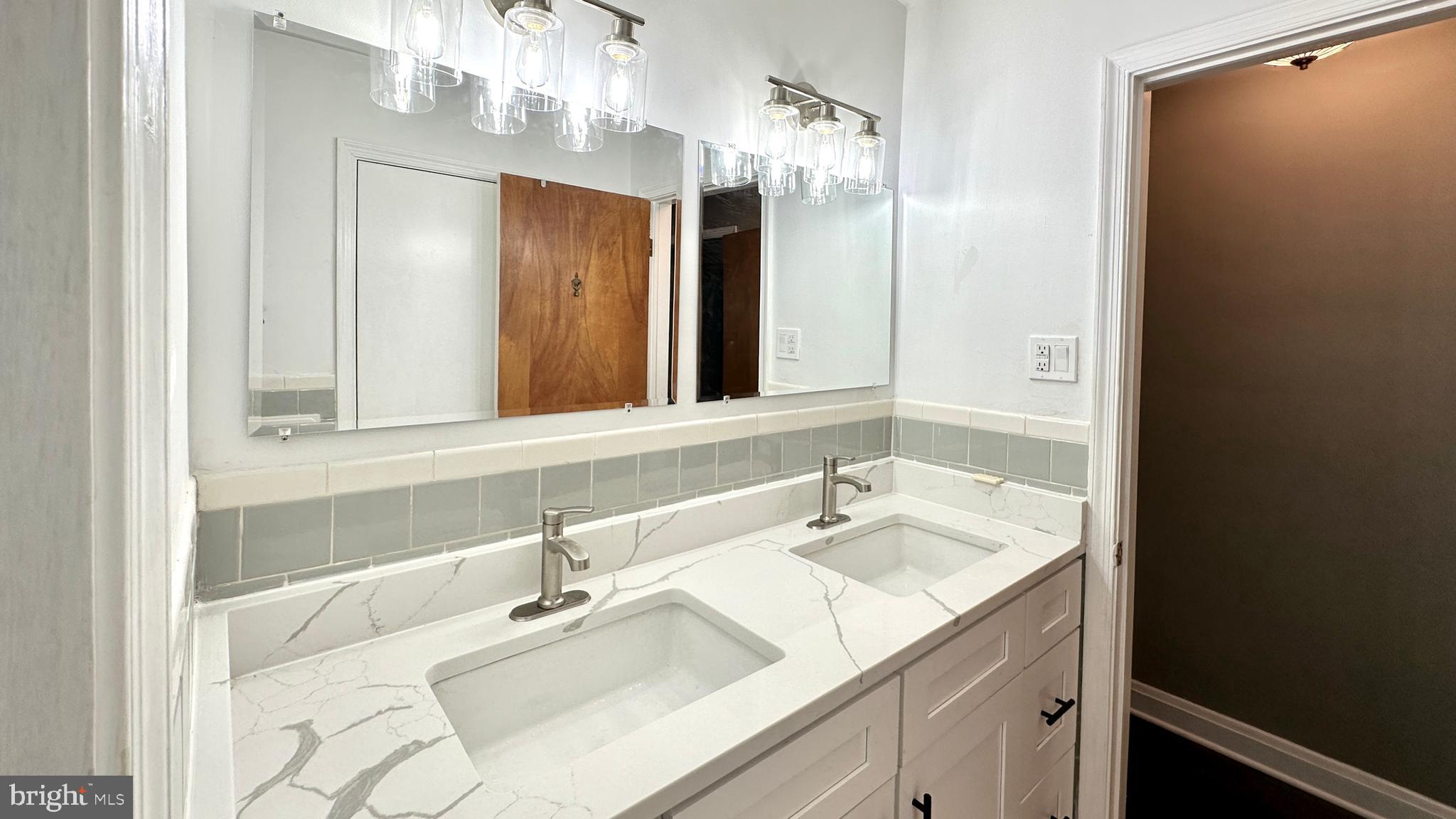 37 Othoridge Road Lutherville-Timonium, MD 21093 - Photo 27 of 38 a bathroom with a sink and a mirror