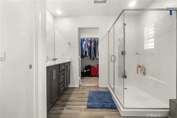 a hallway with wooden cabinets and a window