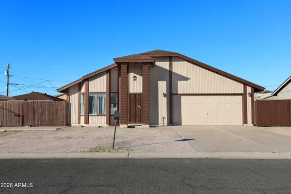 a front view of a house with a garage