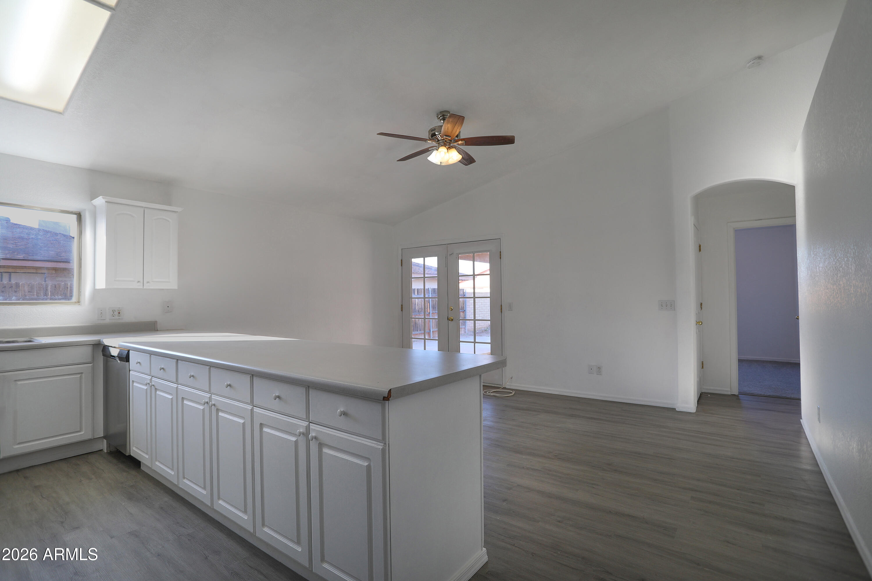 762 West 17th Avenue Apache Junction, AZ 85120 - Photo 4 of 19 a kitchen with a sink cabinets and wooden floor