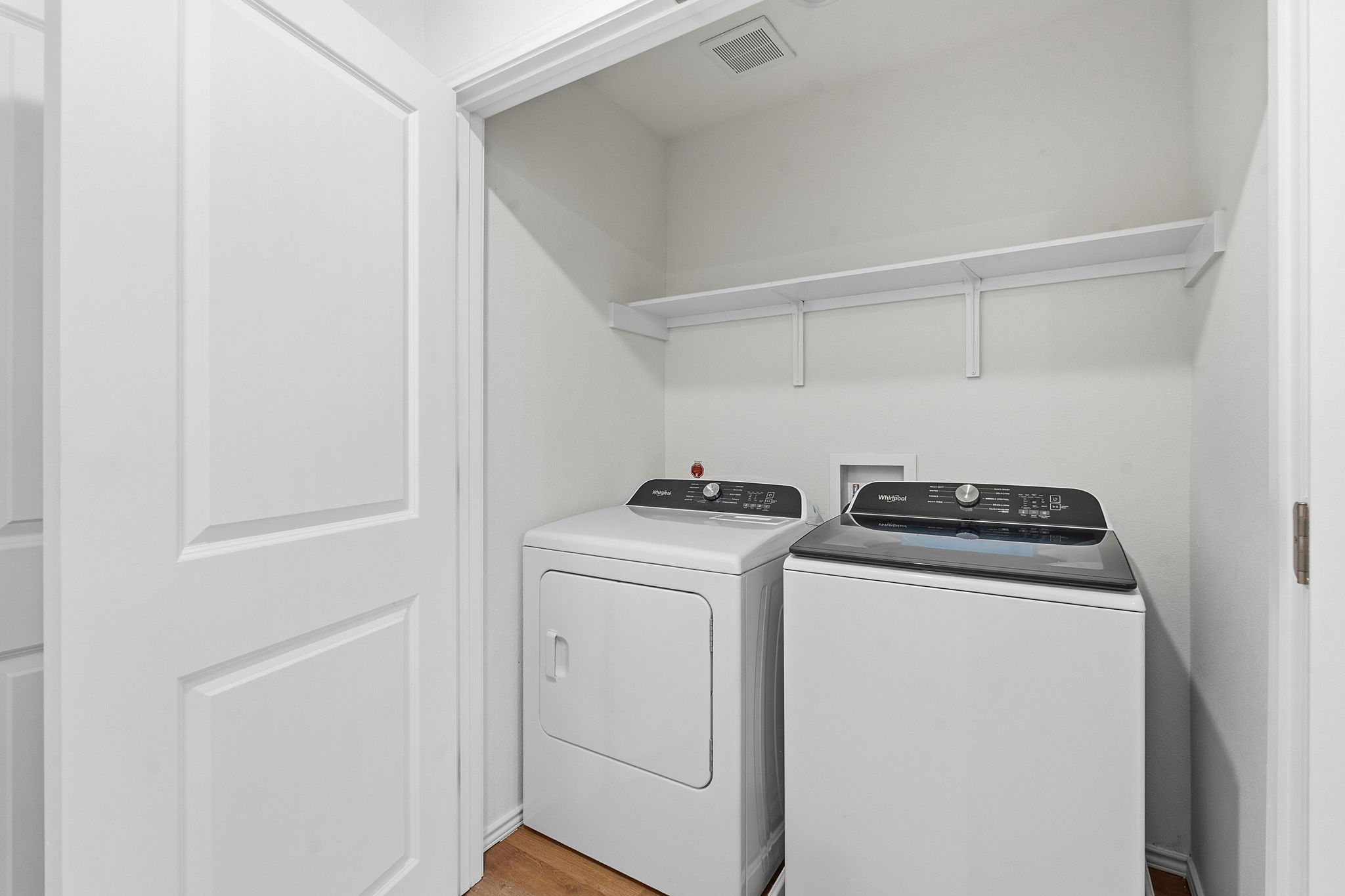 164 Cinnabar Lane, Unit 4 Kyle, TX 78640 - Photo 21 of 23 Dedicated laundry closet featuring a top-load washer and front-load dryer