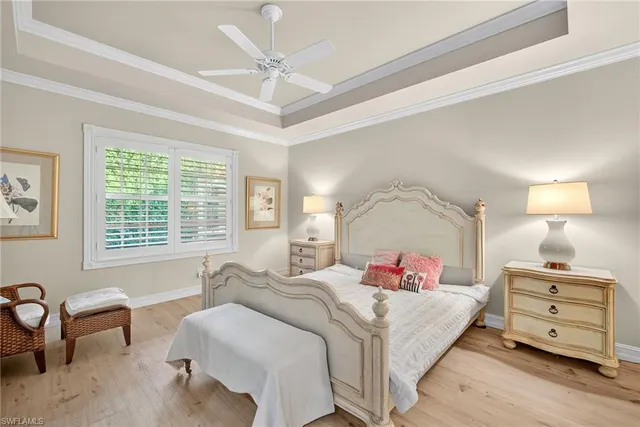 a bed room with a bed and a chair