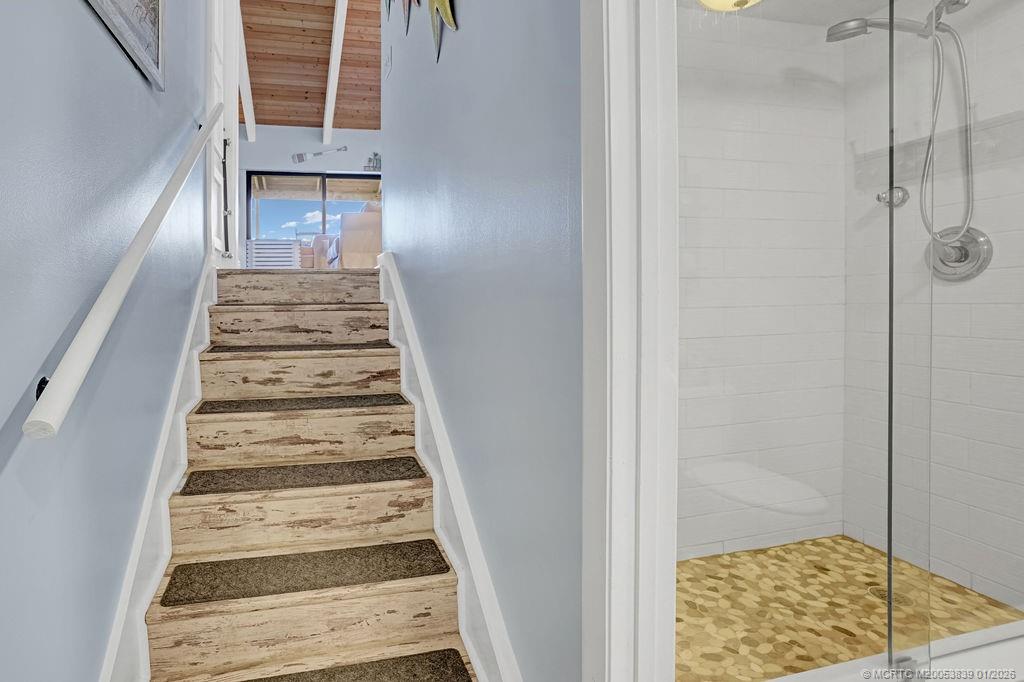 2355 Northeast Ocean Boulevard, Unit 39B Stuart, FL 34996 - Photo 11 of 22 a view of a hallway with wooden floor and staircase