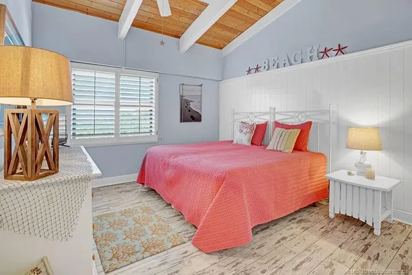 a bedroom with a bed and a couch