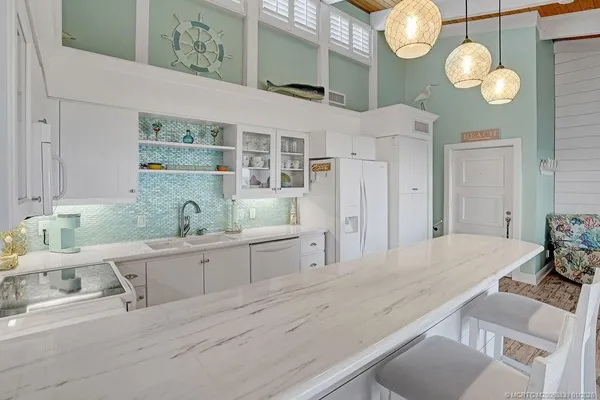 a spacious bathroom with a double vanity sink and a mirror