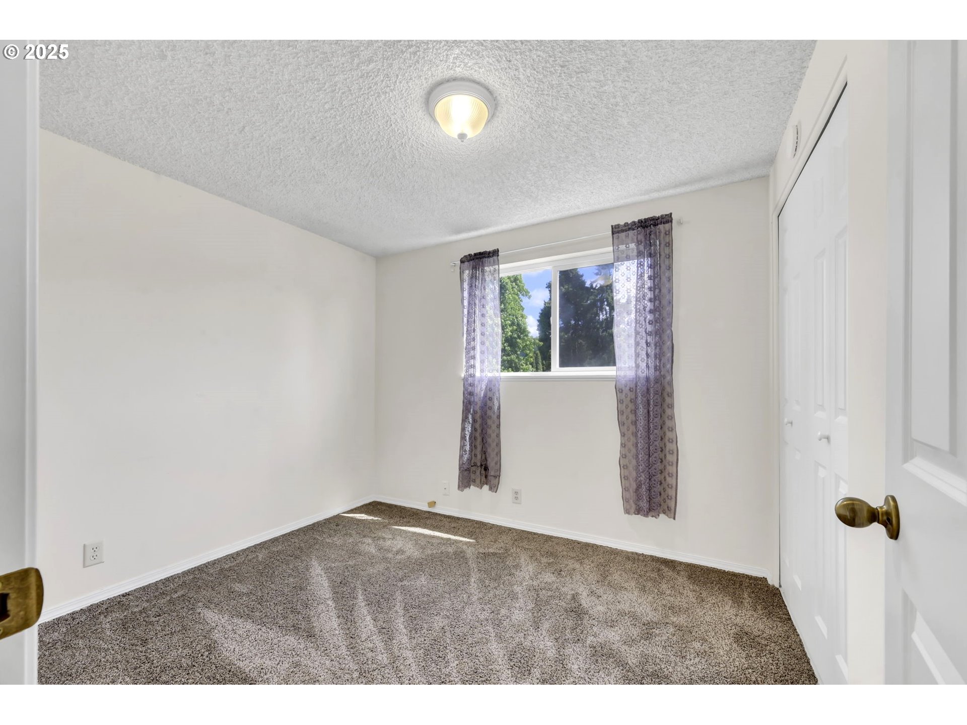 523 65th Street Springfield, OR 97478 - Photo 23 of 29 a view of an empty room with a window