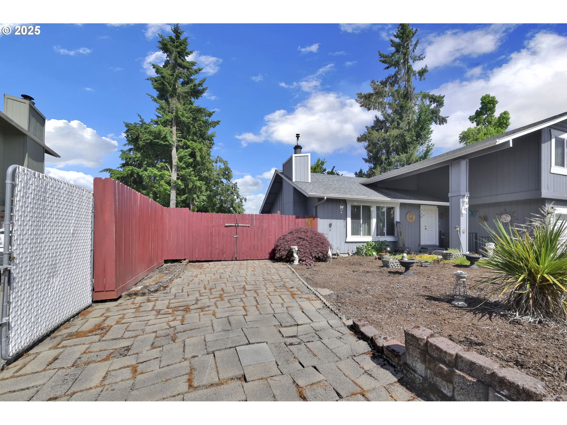 523 65th Street Springfield, OR 97478 - Photo 3 of 29 a view of an house with backyard space and garden
