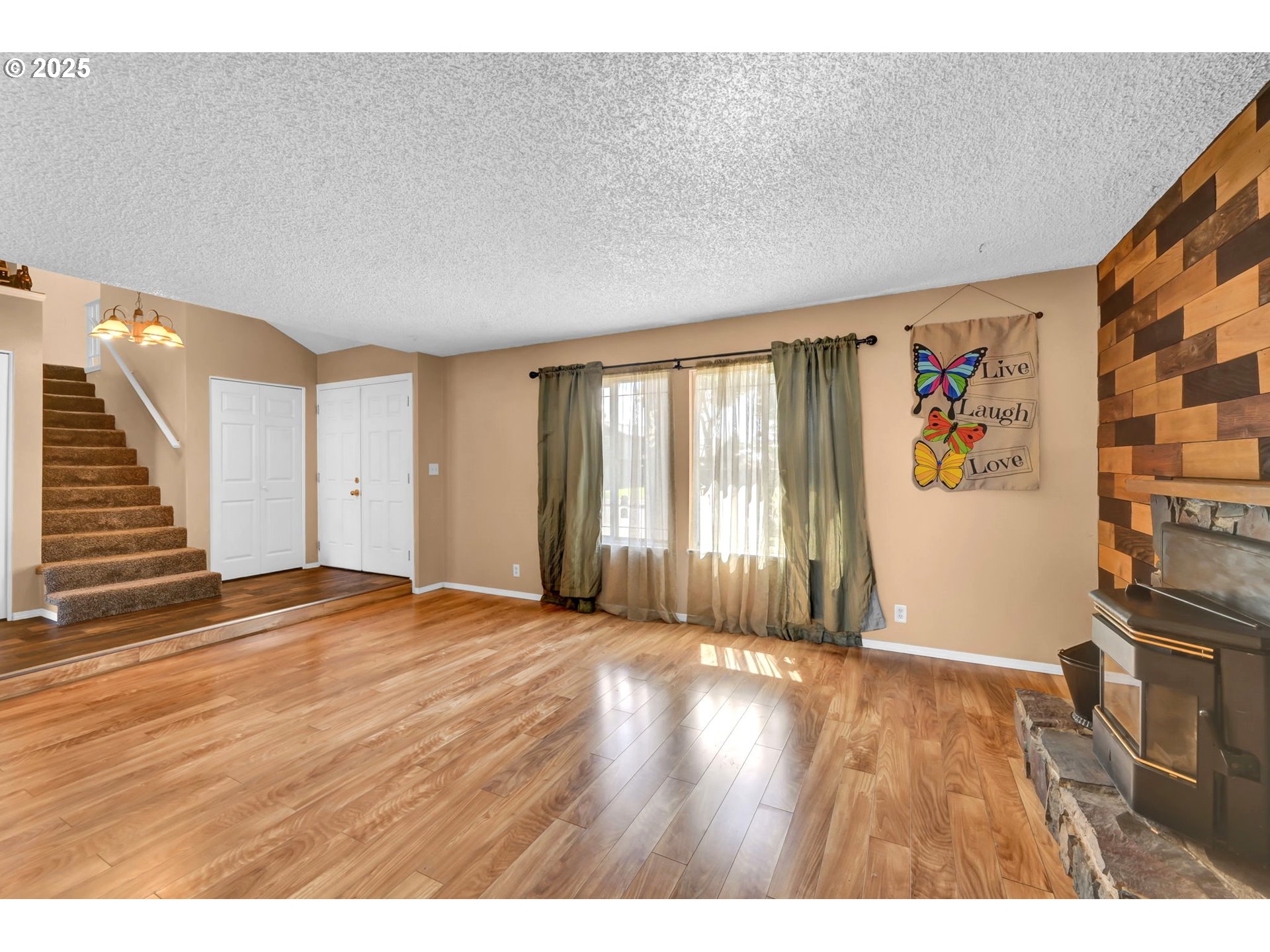 523 65th Street Springfield, OR 97478 - Photo 6 of 29 a view of an empty room with wooden floor and a window