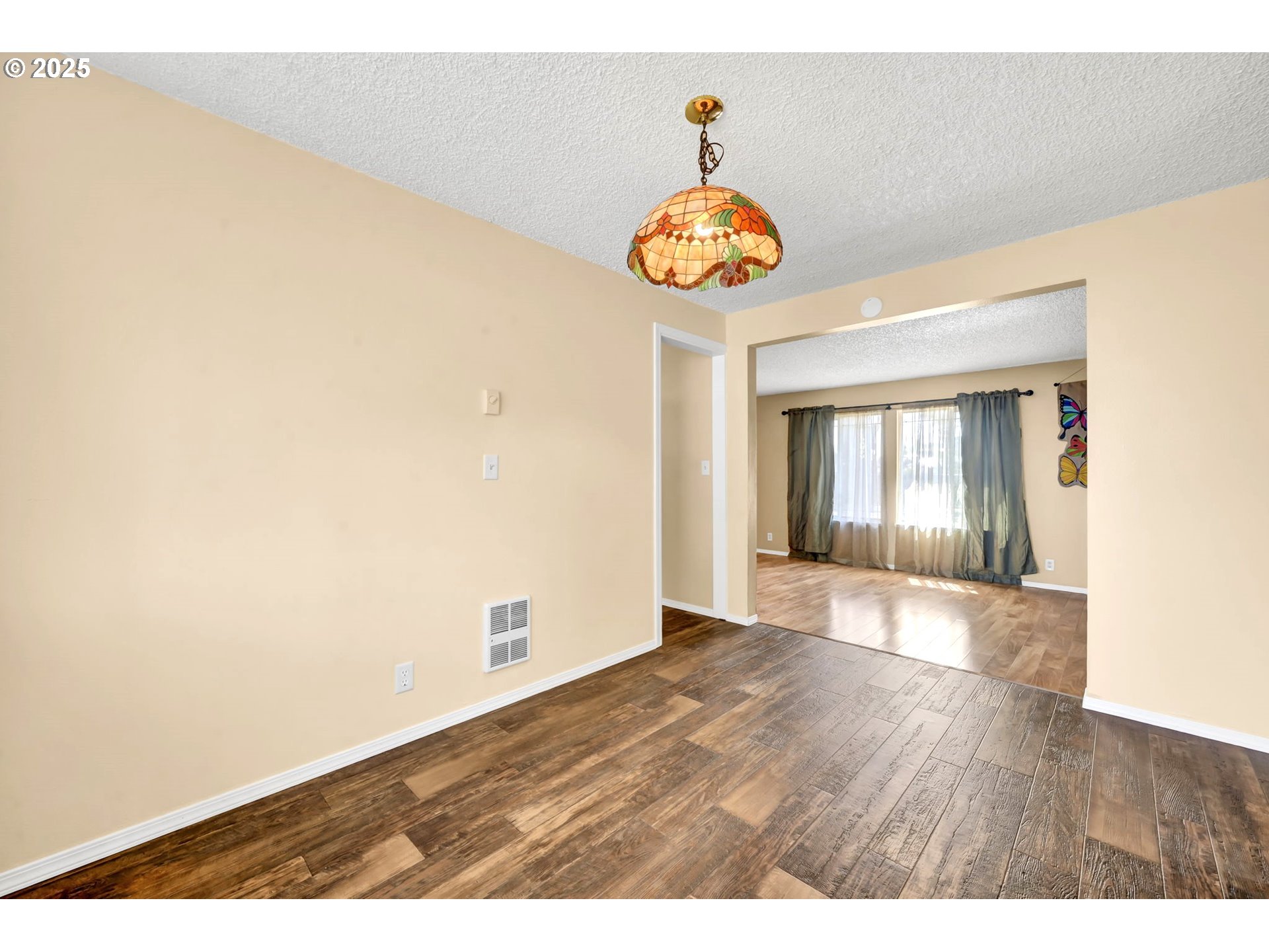 523 65th Street Springfield, OR 97478 - Photo 8 of 29 a view of an empty room with a window