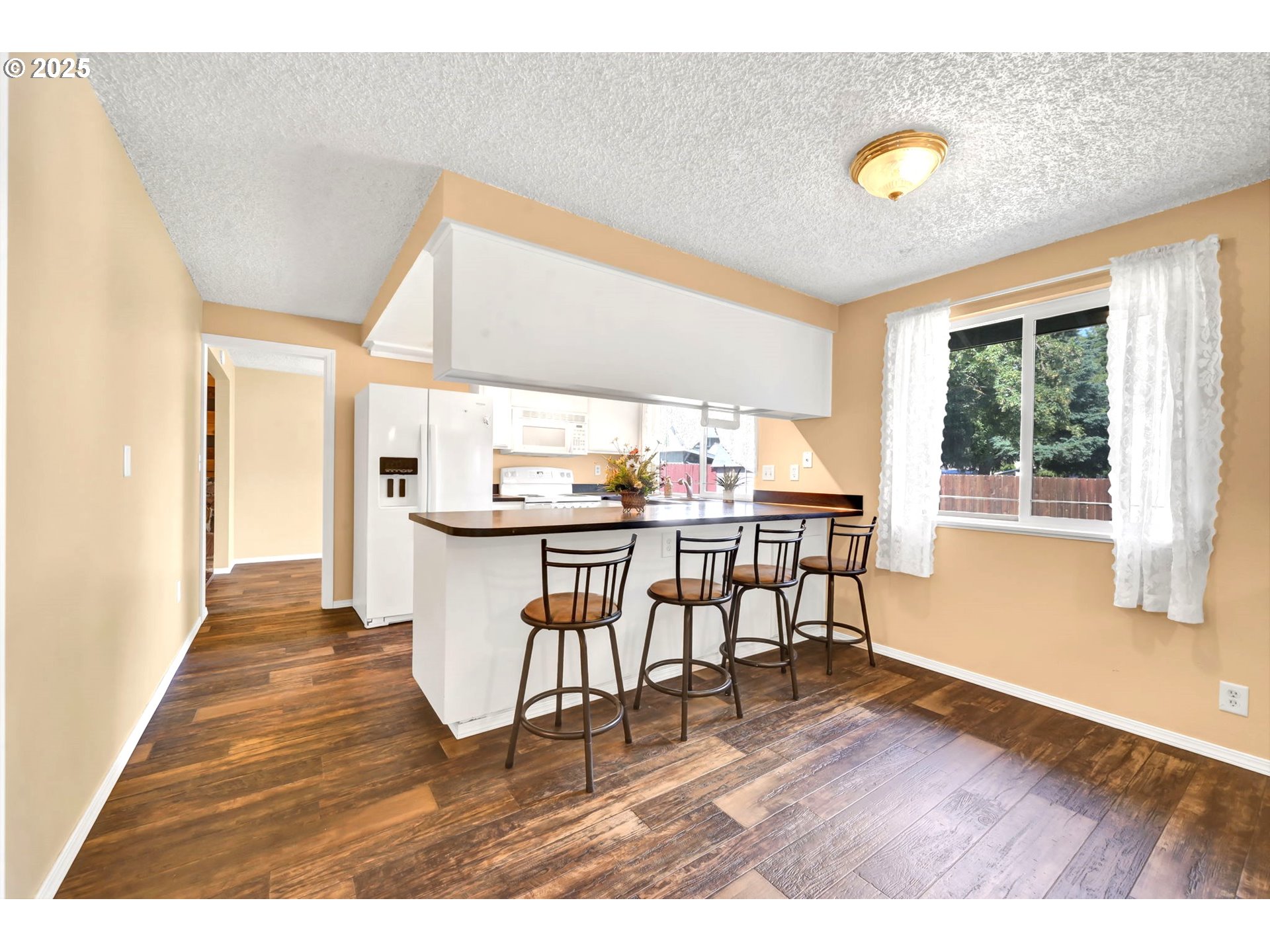 523 65th Street Springfield, OR 97478 - Photo 9 of 29 a view of open kitchen with furniture wooden floor and window