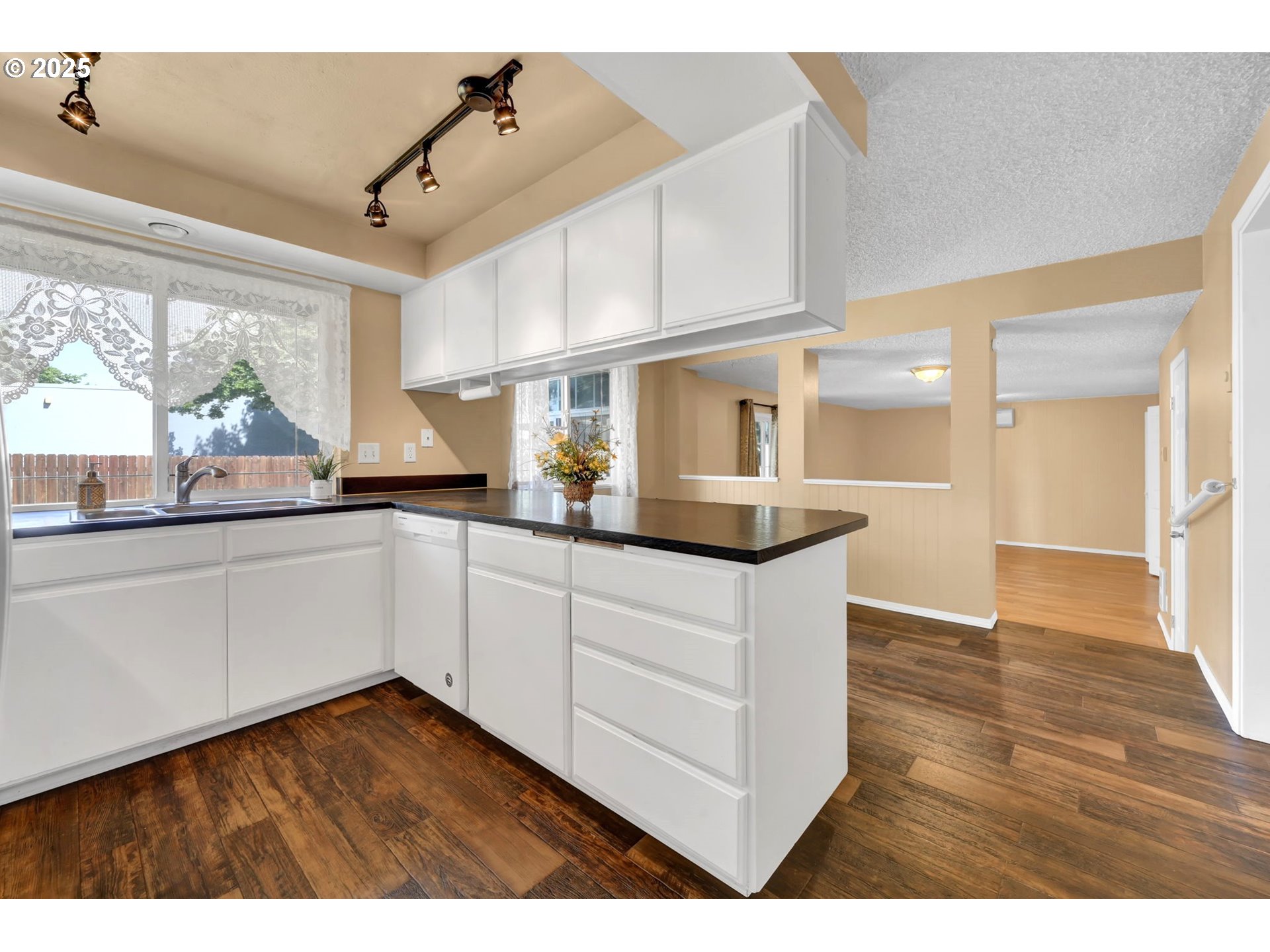 523 65th Street Springfield, OR 97478 - Photo 10 of 29 a kitchen with stainless steel appliances granite countertop a sink window and cabinets