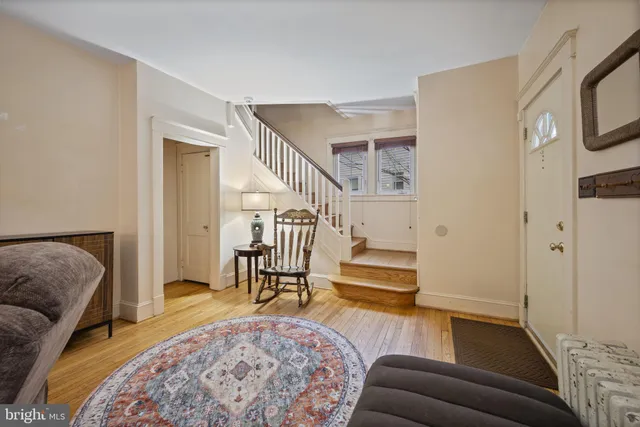 a living room with furniture and a rug