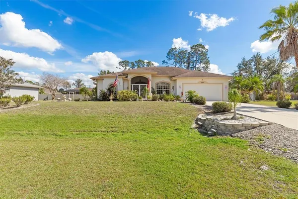 a view of a house with a yard