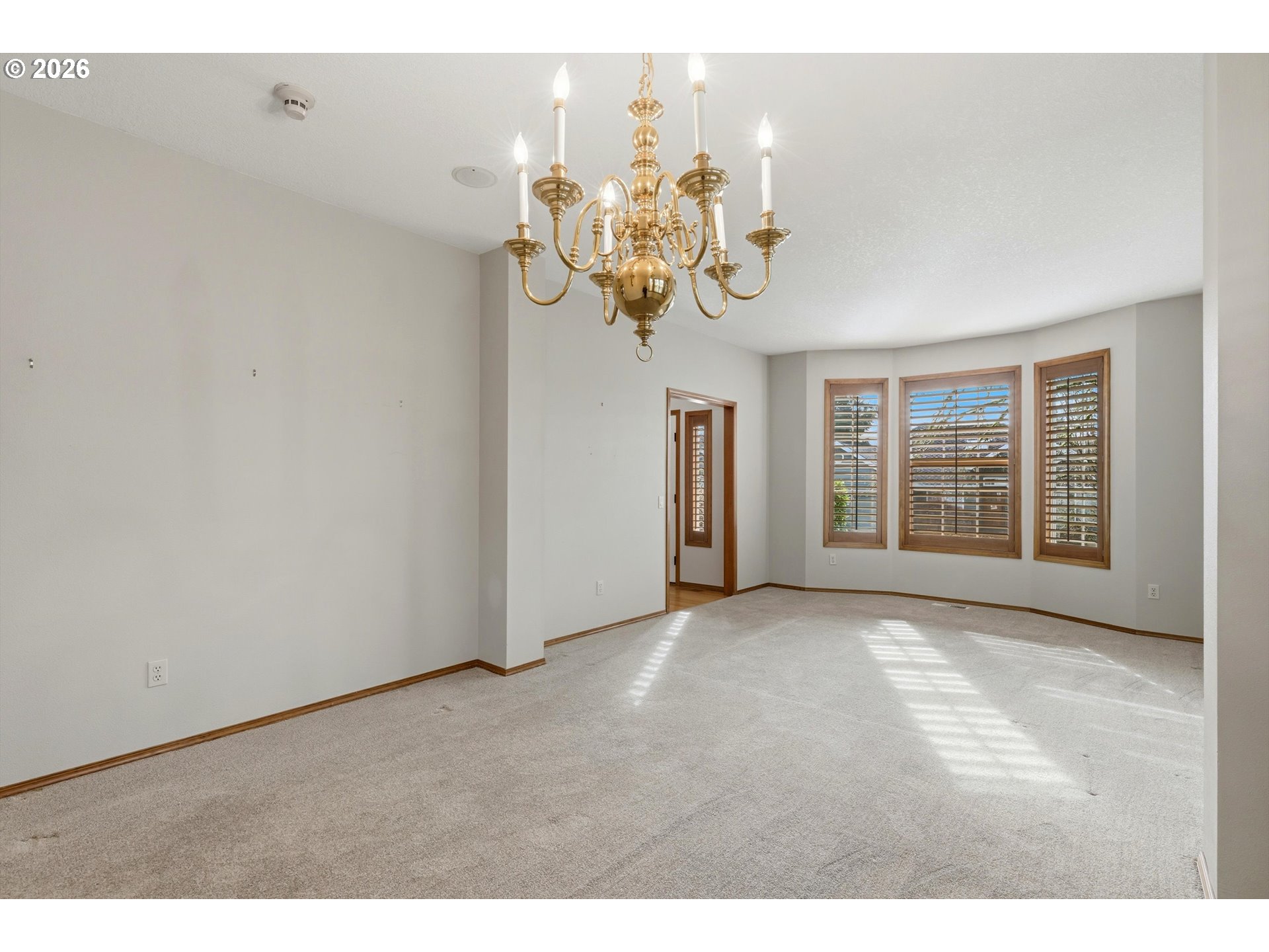 16943 Northwest Patrick Lane Portland, OR 97229 - Photo 13 of 45 a view of a room with a chandelier