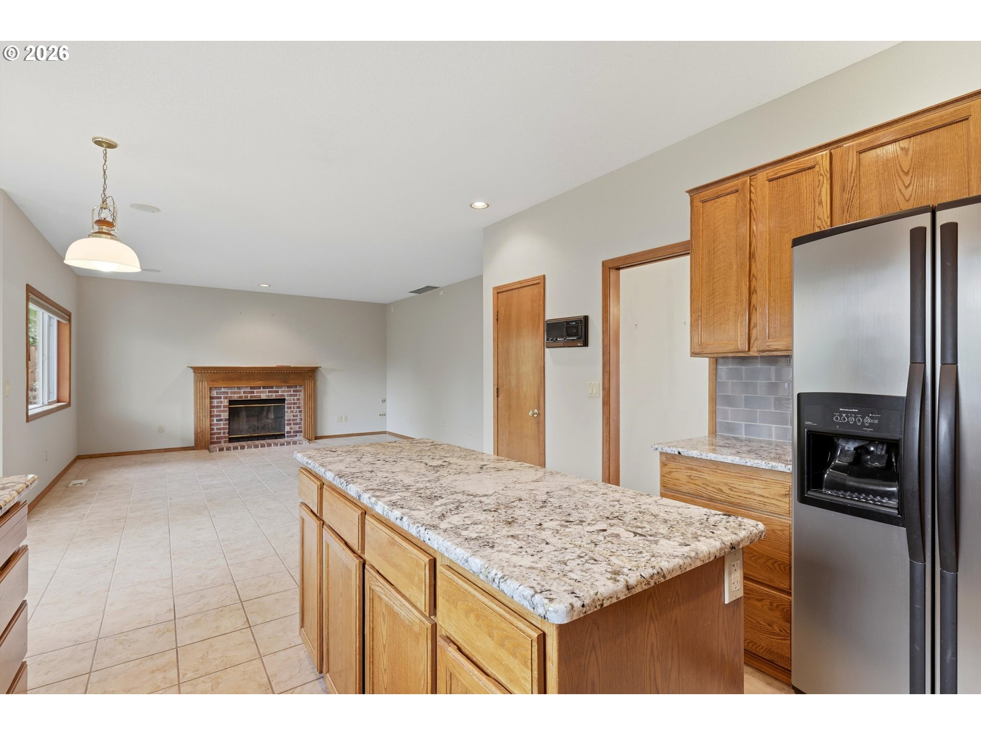 16943 Northwest Patrick Lane Portland, OR 97229 - Photo 19 of 45 a kitchen with stainless steel appliances granite countertop a sink refrigerator and cabinets