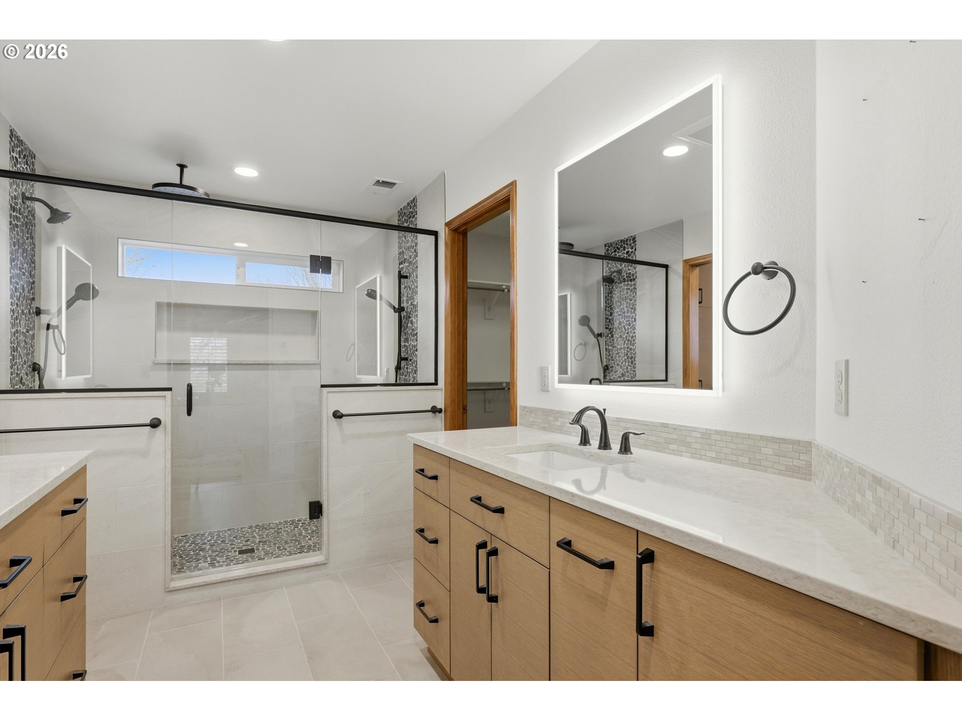 16943 Northwest Patrick Lane Portland, OR 97229 - Photo 26 of 45 a bathroom with a sink double vanity and a mirror