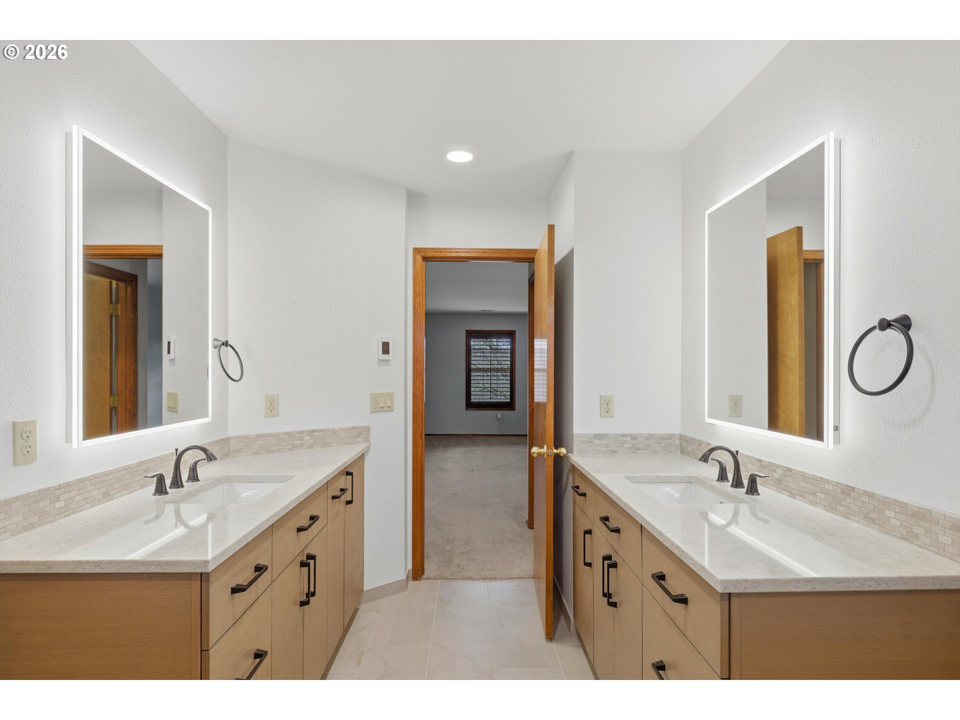 16943 Northwest Patrick Lane Portland, OR 97229 - Photo 30 of 45 a bathroom with a double vanity sink mirror and double