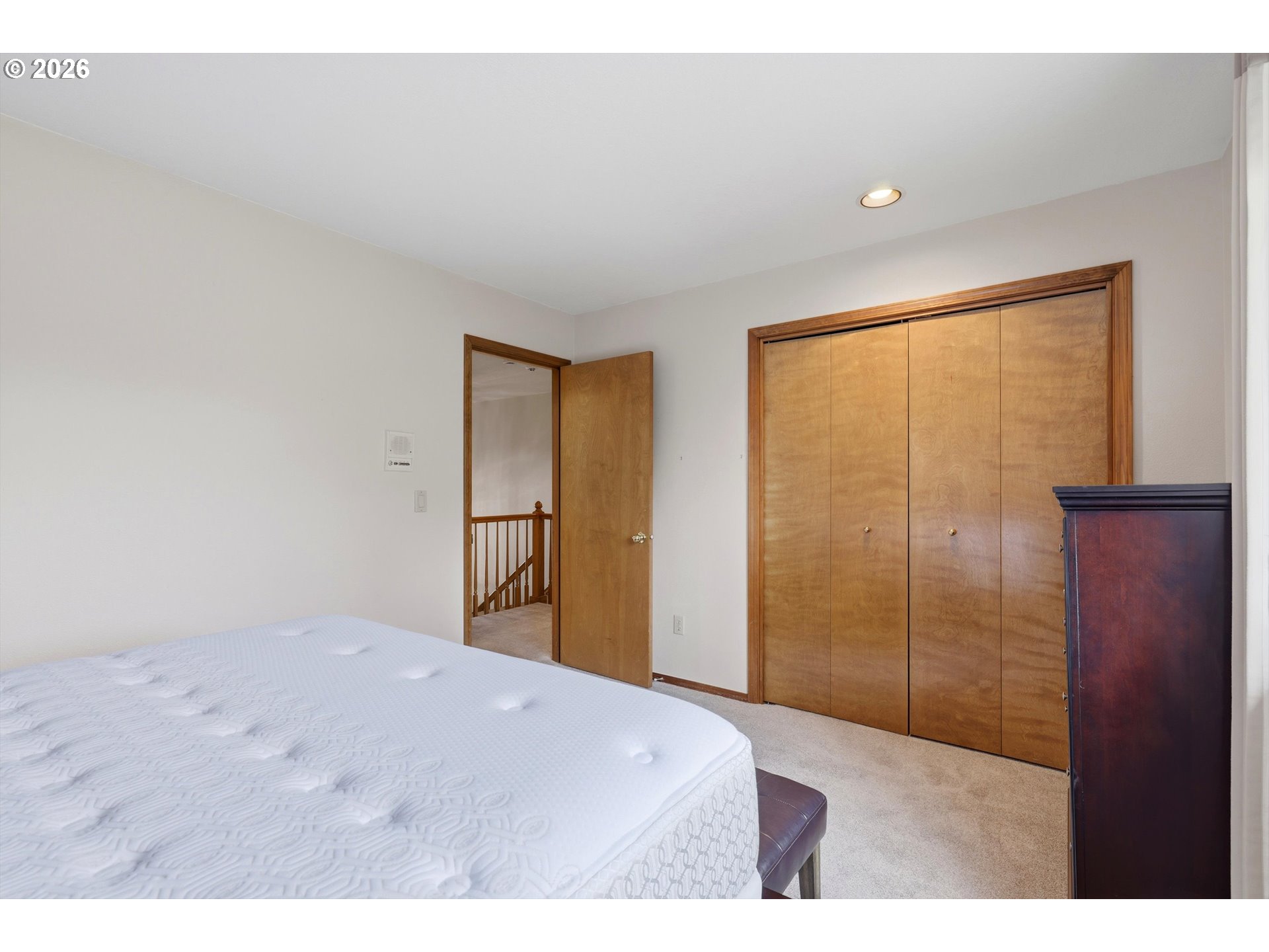16943 Northwest Patrick Lane Portland, OR 97229 - Photo 32 of 45 a bedroom with a bed and a dresser