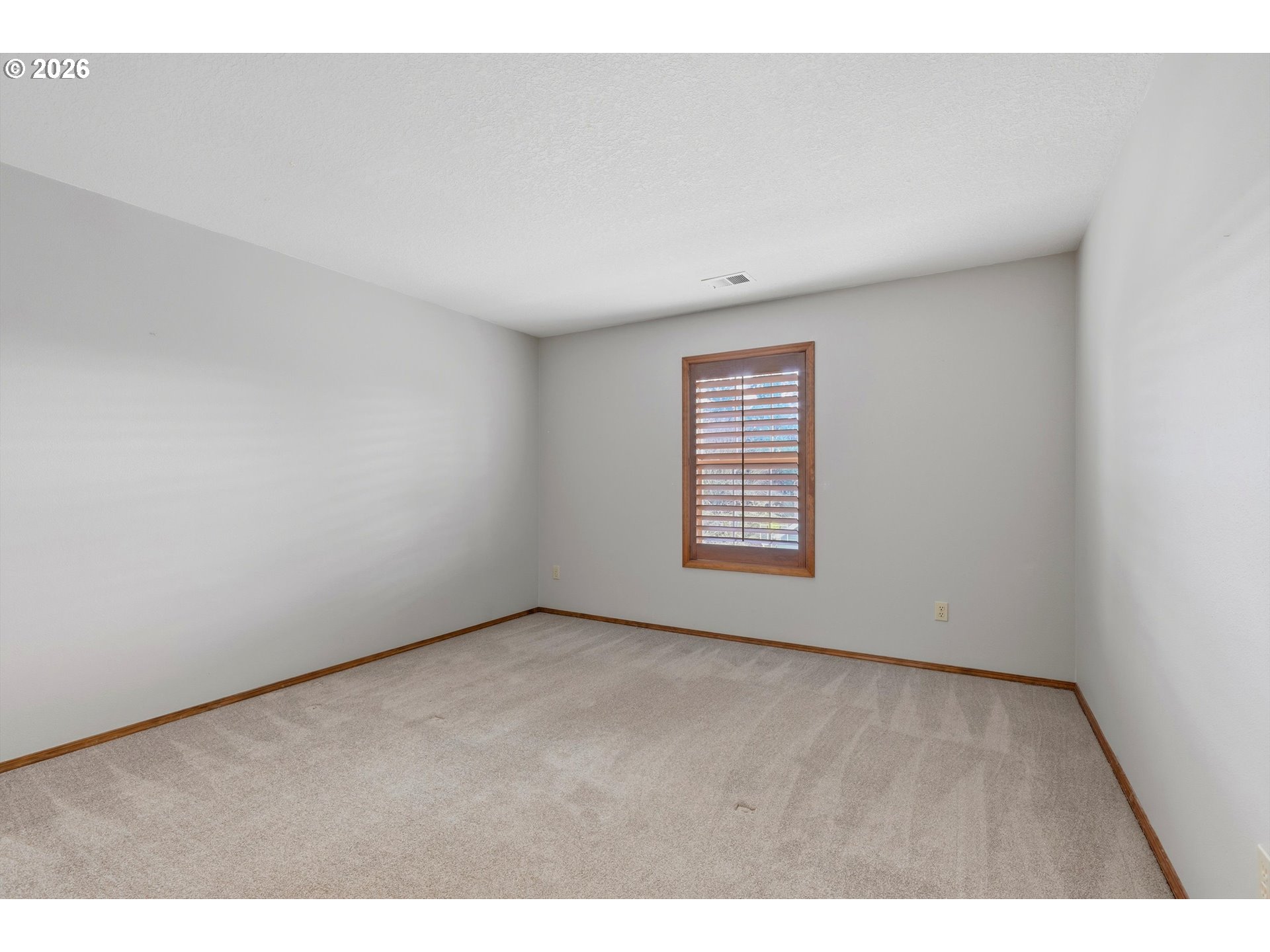 16943 Northwest Patrick Lane Portland, OR 97229 - Photo 34 of 45 a view of an empty room with a window