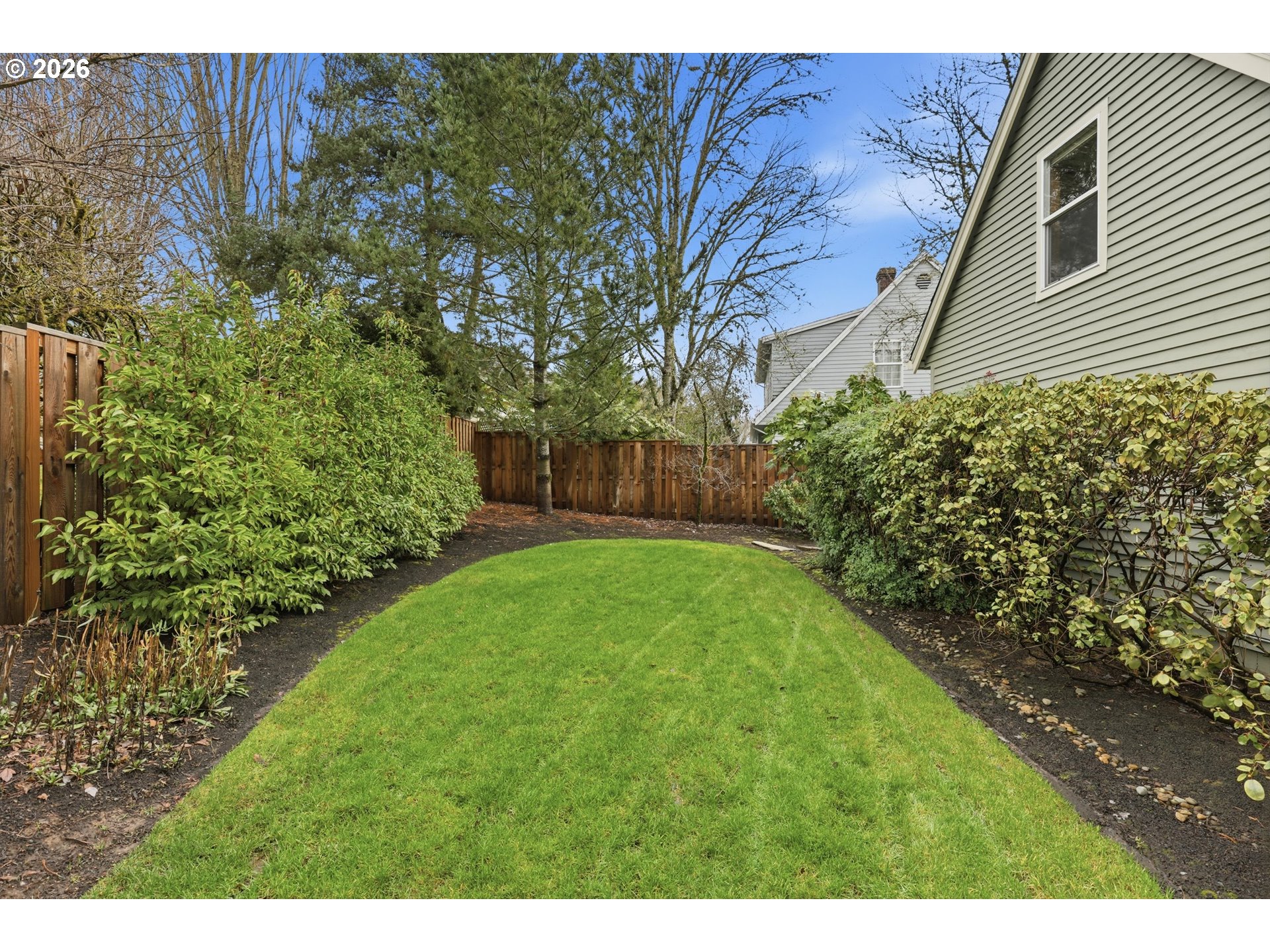 16943 Northwest Patrick Lane Portland, OR 97229 - Photo 8 of 45 a backyard of a house with lots of green space