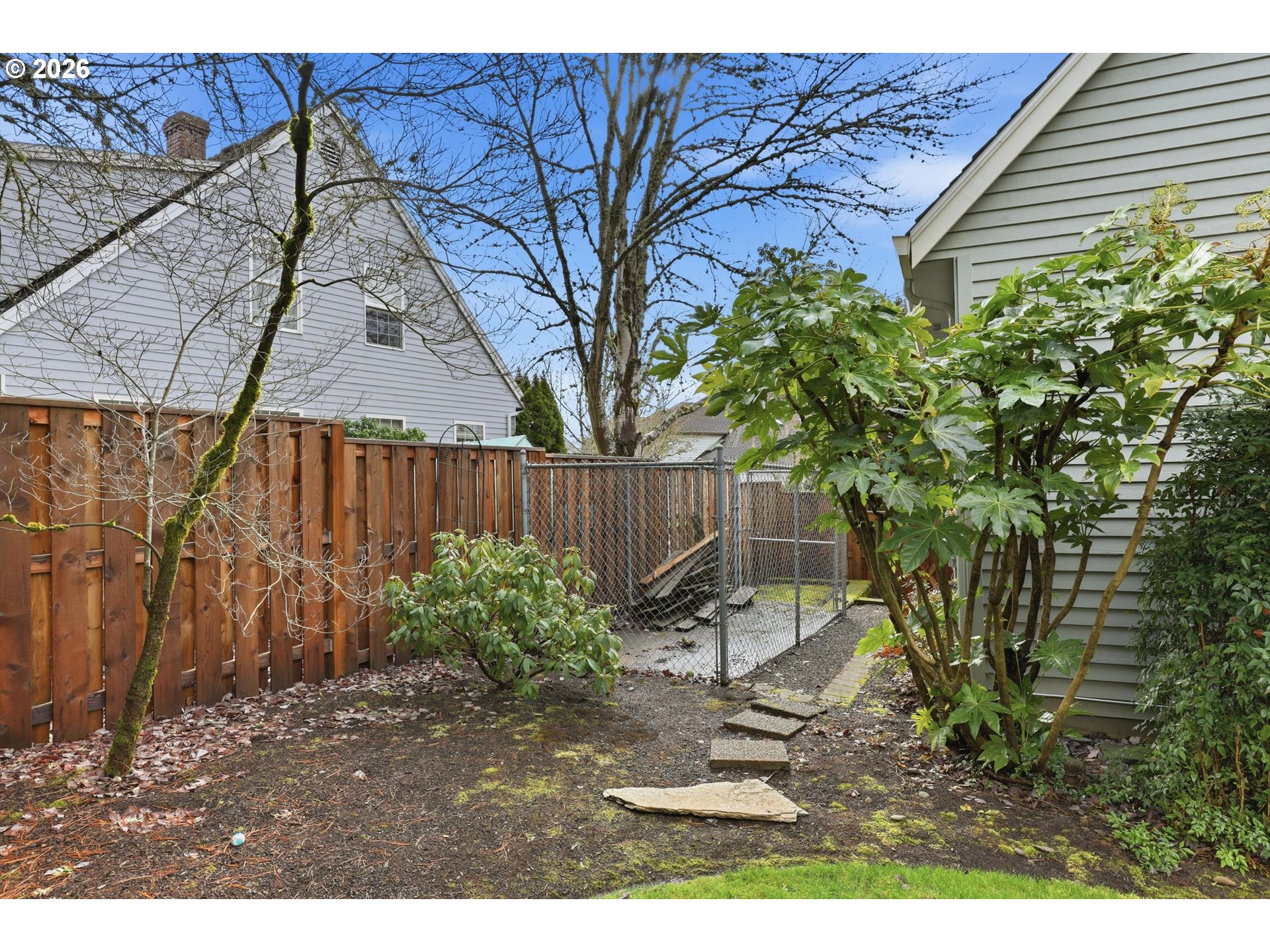 16943 Northwest Patrick Lane Portland, OR 97229 - Photo 9 of 45 a backyard of a house with table and chairs