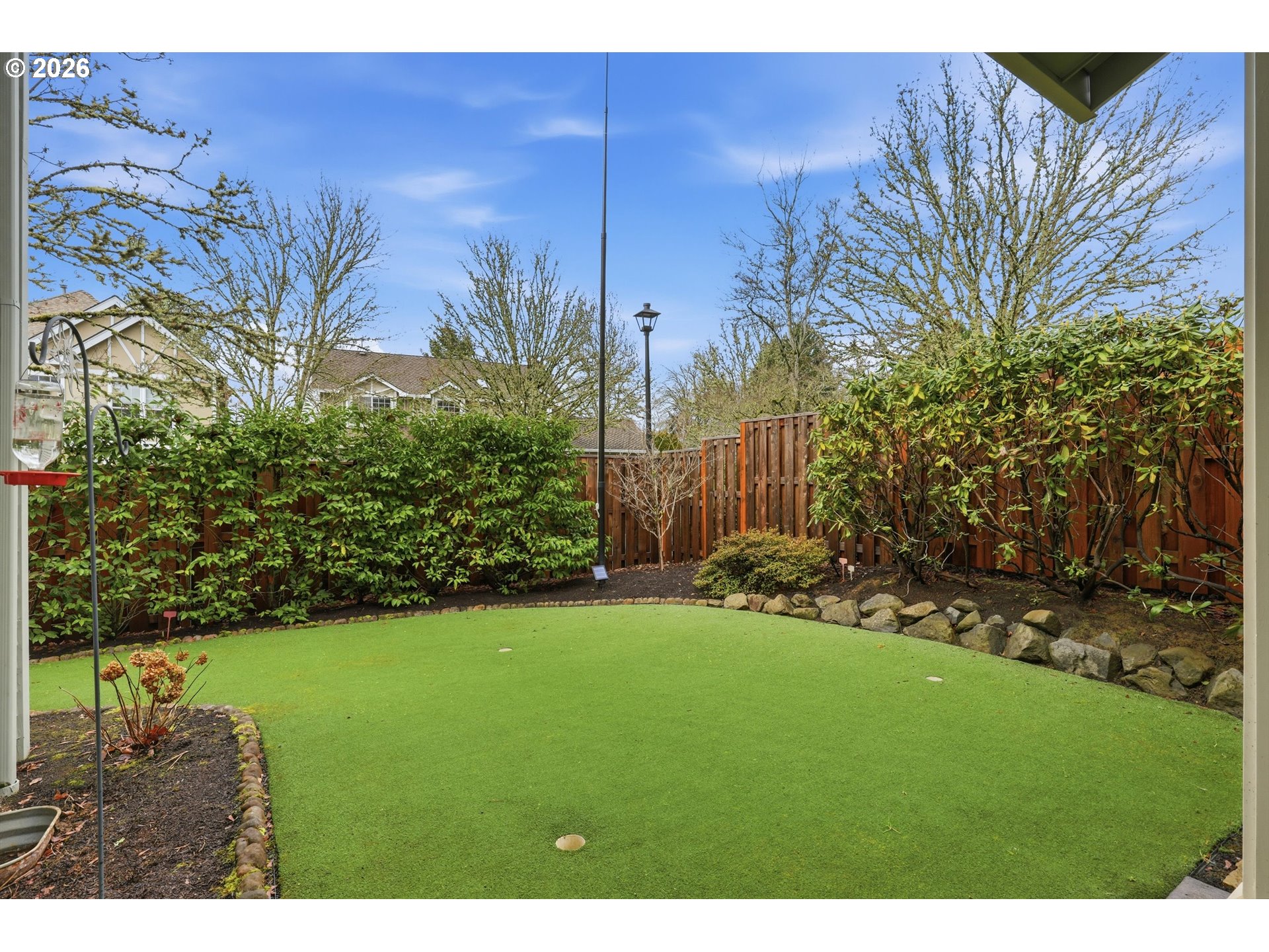 16943 Northwest Patrick Lane Portland, OR 97229 - Photo 10 of 45 a view of a backyard with a garden
