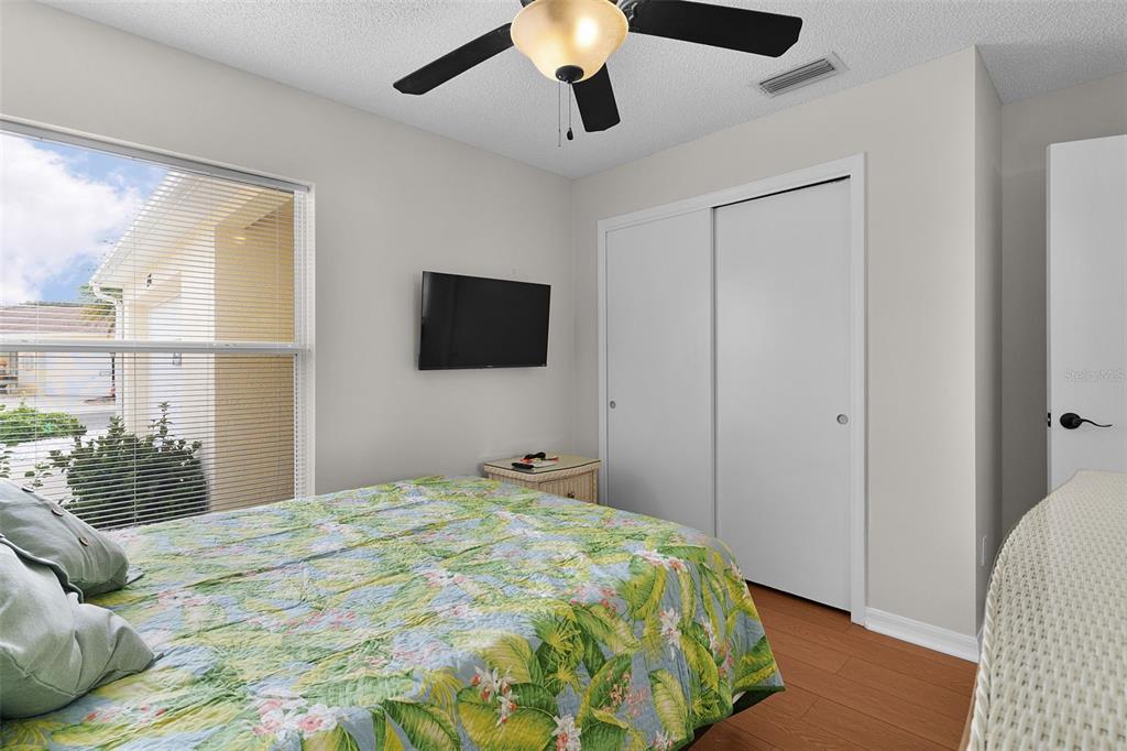 1116 San Bernardo Road The Villages, FL 32162 - Photo 26 of 46 a bedroom with a bed and a flat screen tv