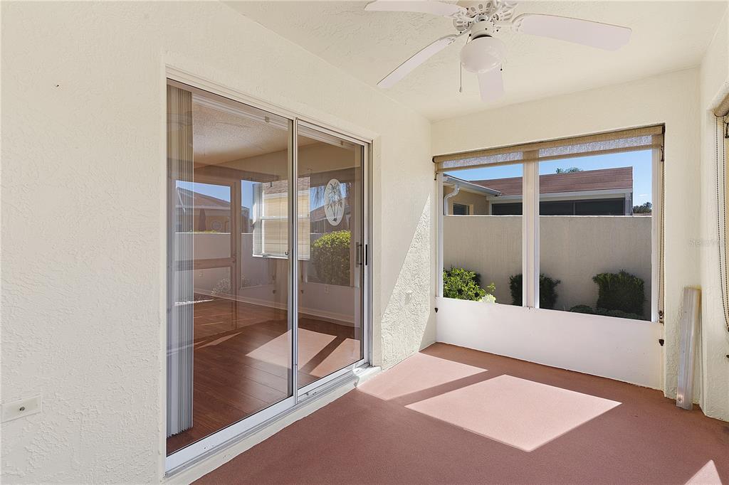 1116 San Bernardo Road The Villages, FL 32162 - Photo 31 of 46 a view of a big room with windows and entryway