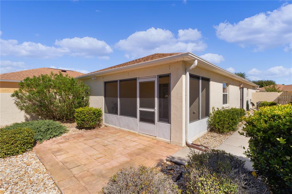 1116 San Bernardo Road The Villages, FL 32162 - Photo 35 of 46 a view of a house with a yard